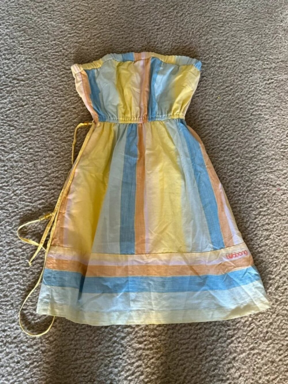 yellow and blue striped strapless dress with tie in the back